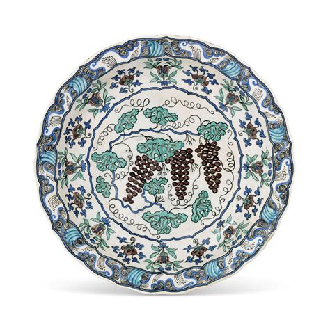 A LARGE IZNIK-STYLE POTTERY 'GRAPE' DISH , FRANCE, CIRCA 1860-80 | Christie's