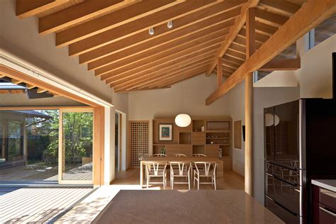 Timber-Framed Japanese House Built Around Private Gardens