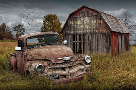 Chevy Photograph - Rusted Chevy Pickup Truck In A Rural Landscape By A Mail Pouch Tobacco Barn ...