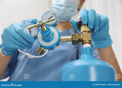 Medical Worker Checking Oxygen Tank in Hospital Room, Closeup Stock Photo - Image of cylinder ...