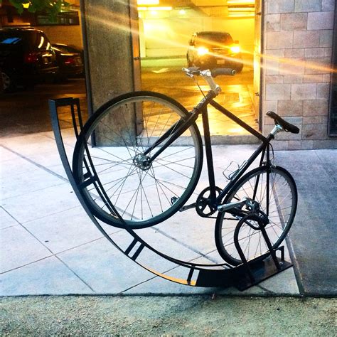 Vertical bike rack designed by Bike Arc in California. | Outdoor bike racks, Bicycle rack, Bike ...