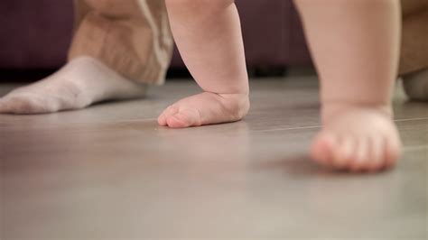 Little Feet Learning To Walk With Father's Stock Footage SBV-323798931 ...