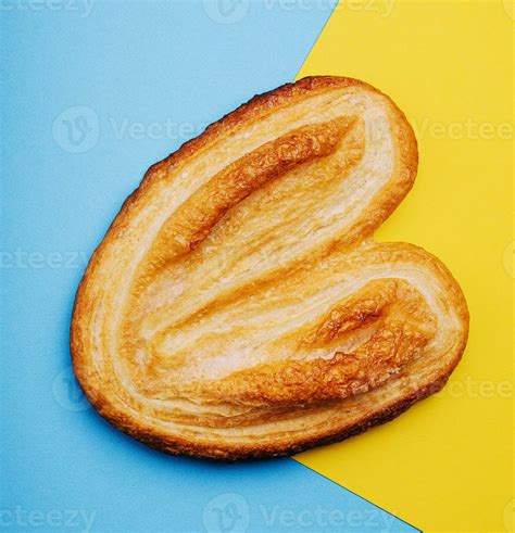 Puff pastry cookies on blue and yellow background 32622485 Stock Photo at Vecteezy