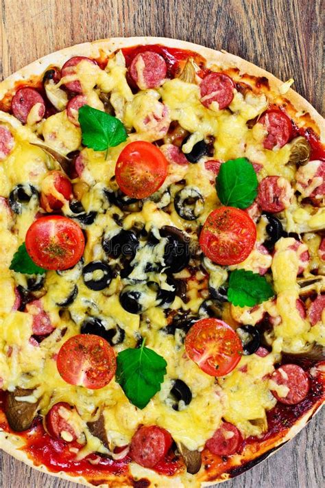 Pepperoni Pizza With Sausage, Cheese, Mozzarella, Olives And Basil Stock Image - Image of food ...