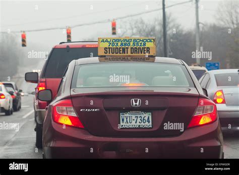 Student driver (learner driver) sign on top of driver training car ...