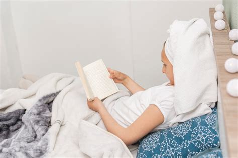 Free Photo | Woman reading while in bed