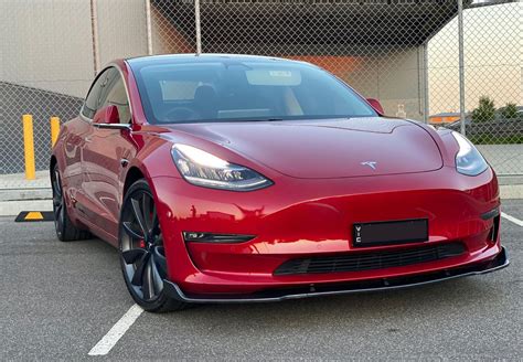 Red Tesla model 3 with carbon fiber front lip – Tesla Model 3 Wiki