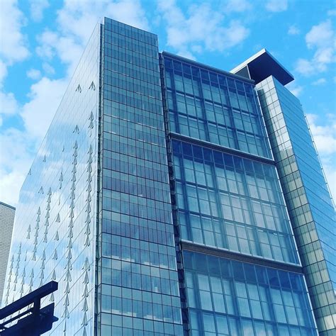 Low Angle View of Glass High Rise Building during Cloudy Daytime Photo · Free Stock Photo