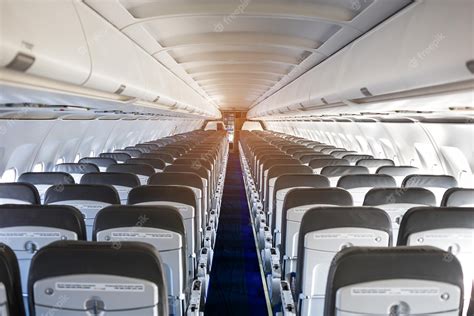 Premium Photo | Passenger plane interior empty airplane interior with ...