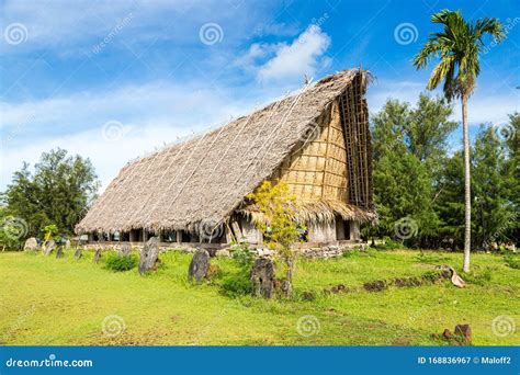 Traditional Thatched Yapese Men`s Meeting House Faluw or Fale and a Bank of Stone Money Rai. Yap ...