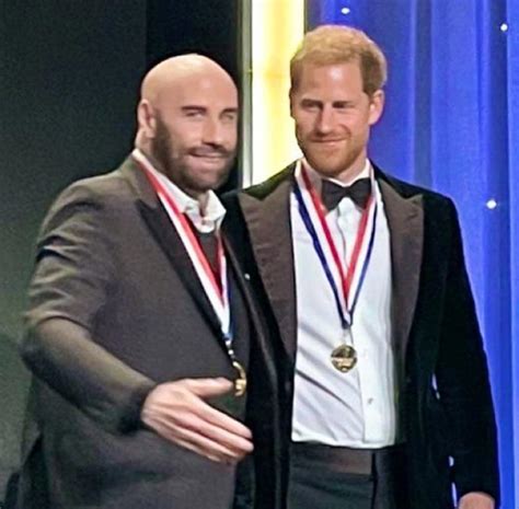 Prince Harry steps out solo to accept aviation award with John Travolta after dropping libel ...