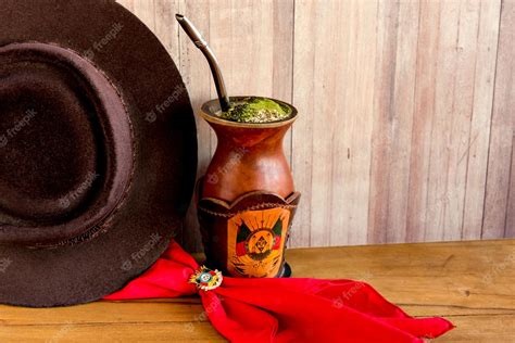 Premium Photo | Gaucho tradition hat red scarf and yerba mate tea