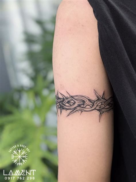 Crown Of Thorns Tattoo on arm | Thorn tattoo, Tattoos, Arm band tattoo