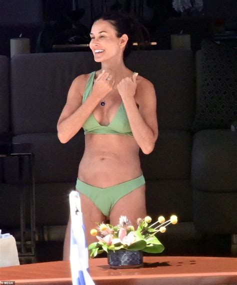 EXCLUSIVE: Demi Moore, 60, makes a splash in green bikini as she soaks ...