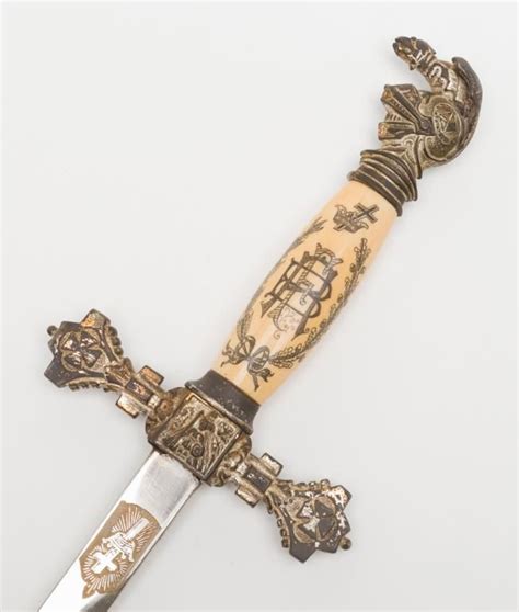 Ornate Knights of Columbus Lodge sword with metal scabbard, etched blade includes name “Ben F. All