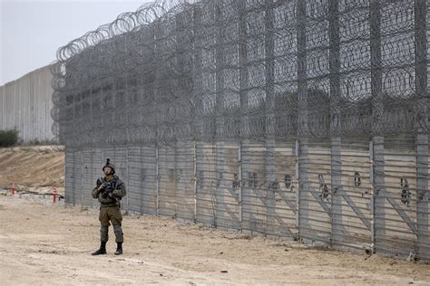 Israel announces completion of security barrier around Gaza | AP News