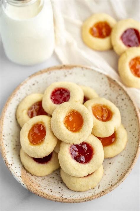 Soft and delicious buttery shortbread cookies filled with strawberry and apricot jam. These Cla ...