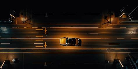 Premium Photo | A view of a car with its headlights on driving at night ...