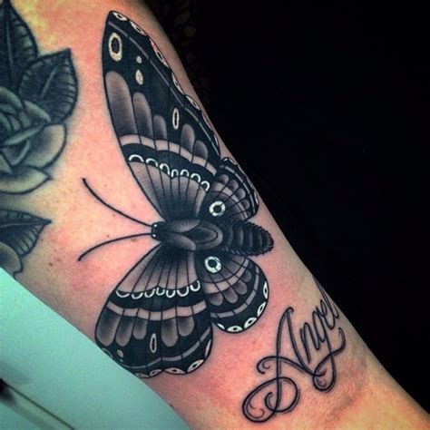 White and black moth tattoo on girls wrist - Tattooimages.biz