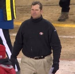 Jim Harbaugh tucks clothes into pleated khaki pants, looks like ...