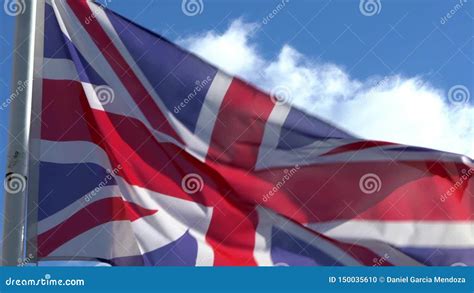 Slow Motion of English Flag Waving in Wind on Flagpole at an City ...