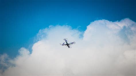 2 Quadcopter Under Blue Sky and White Clouds · Free Stock Photo