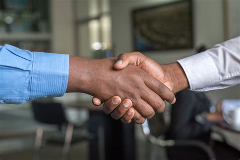 Two Person Hand Shaking · Free Stock Photo