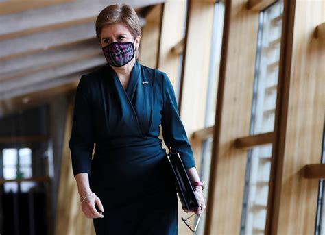 Nicola Sturgeon delays ditching face masks after rise in Covid cases | The Independent