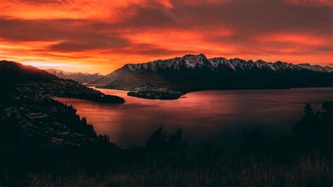 Download New Zealand Orange Mountains Sunset Wallpaper | Wallpapers.com