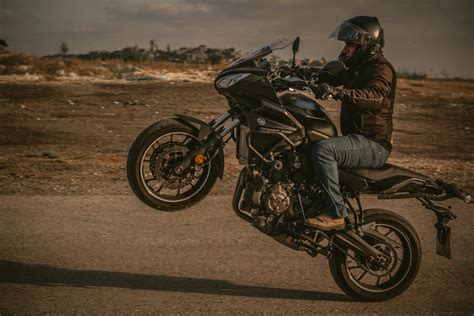 Man Riding on Motorcycle Outdoors · Free Stock Photo