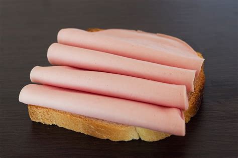 Free Photo | Salami sandwich. open sandwich of salami slices on bread.