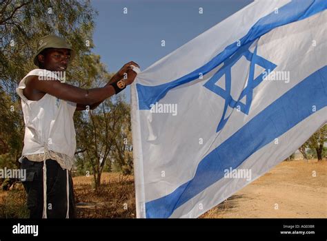 A young member of the Beta Israel community also known as Ethiopian Jews holding the Israeli ...