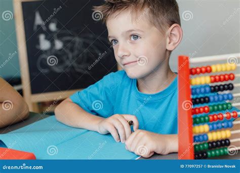 Smiling School Boy Working on Math Homework Stock Image - Image of lifestyle, people: 77097257