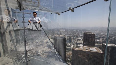 Ride the U.S. Bank Tower's glass Skyslide with 70 floors of nothingness below you - Los Angeles ...