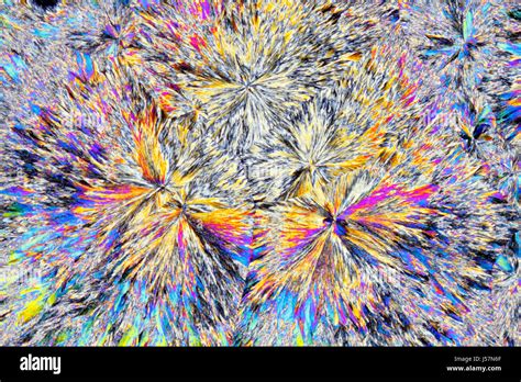 Microscopic view of citric acid crystals. Polarized light, crossed polarizers Stock Photo - Alamy