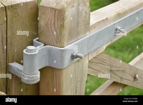 Close up of wooden gate hinge Stock Photo - Alamy