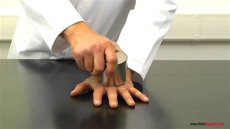 Super-strong neodymium magnets crushing a man's hand - YouTube