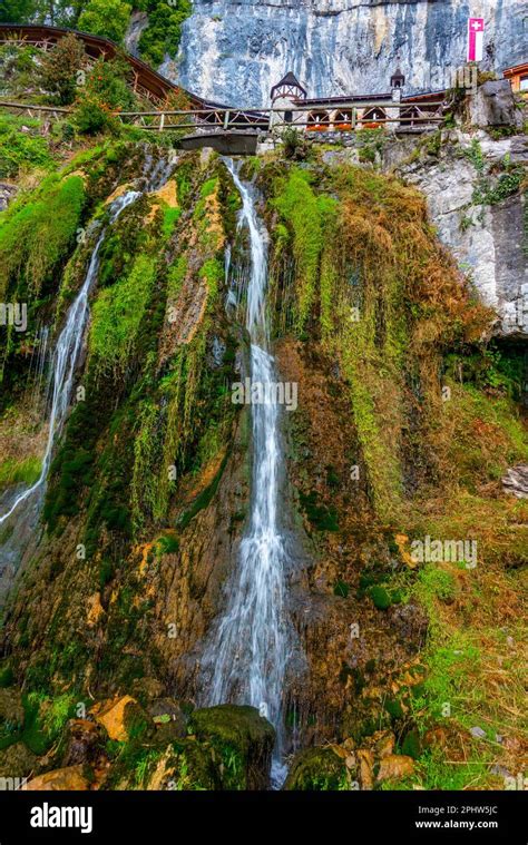 Waterfall flowing from St. Beatus Caves in Switzerland Stock Photo - Alamy