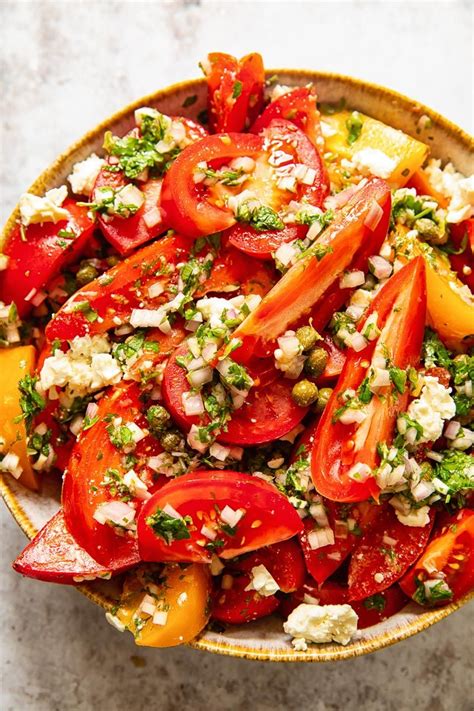 This delicious salad made with ripe tomatoes, capers and feta, then dressed with a fresh herb ...