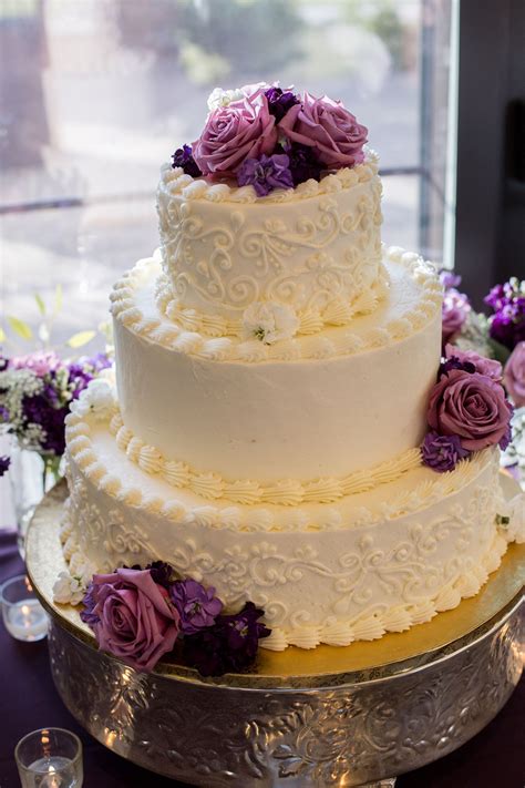 Three-Tier White Wedding Cake, Purple Flowers