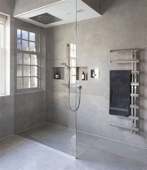 The breathtaking walk-in shower sits perfectly in front of these large ...