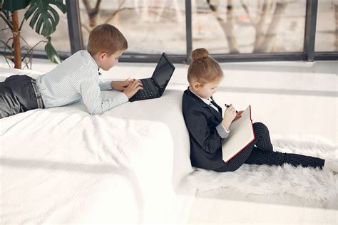 Smart little business children in formal outfits working remotely in team at home · Free Stock Photo