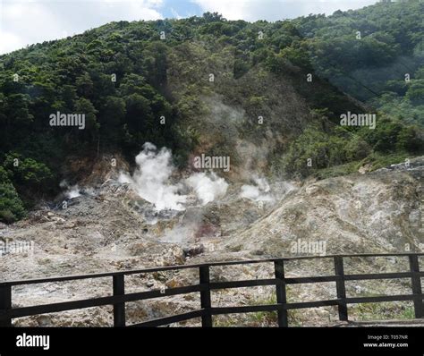 Wide shot of the drive-in volcano at the Sulphur Springs in St Lucia, Caribbean Islands with ...