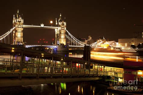 Tower Bridge and Piers with passing boat lights...under the Moon light Photograph by Xabi Lobo ...