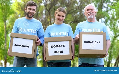 Happy Volunteers Holding Donation Cardboxes, Humanitarian Aid ...