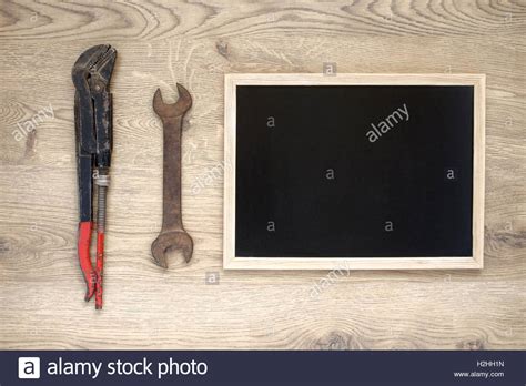 Rusty old hand tools with empty blackboard Stock Photo - Alamy