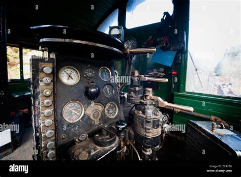 An vintage diesel train interior showing all the knobs, dials, and controls that still runs in ...