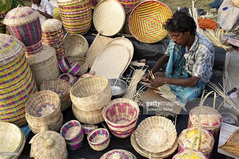 A man engaged in making handicraft products. Handicraft products of ...