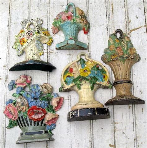 I love these old cast iron door stops, especially the flower baskets... | Cast iron doorstop ...