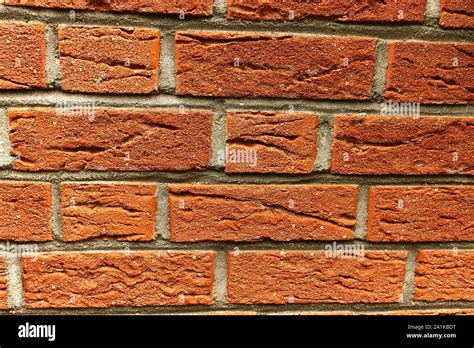 Texture of a carmine red stone wall on a house Stock Photo - Alamy